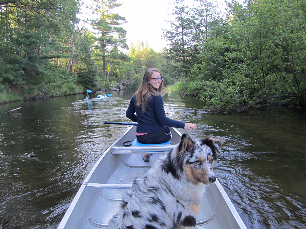 Girl and Dog Canoeing
